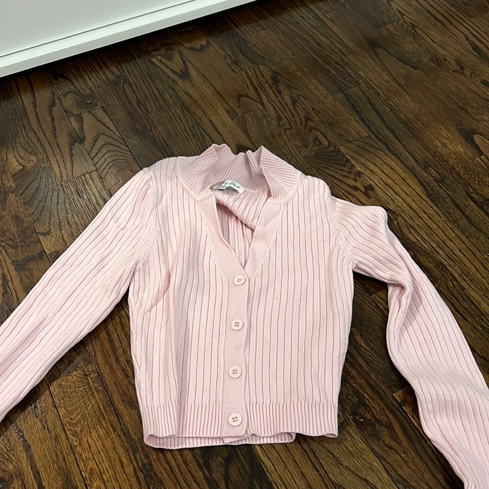 a baby pink tight cropped sweater/buttoned cardigan